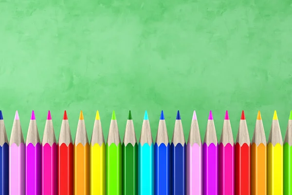 Ready for school concept with pencils in rainbow colors and blackboard background