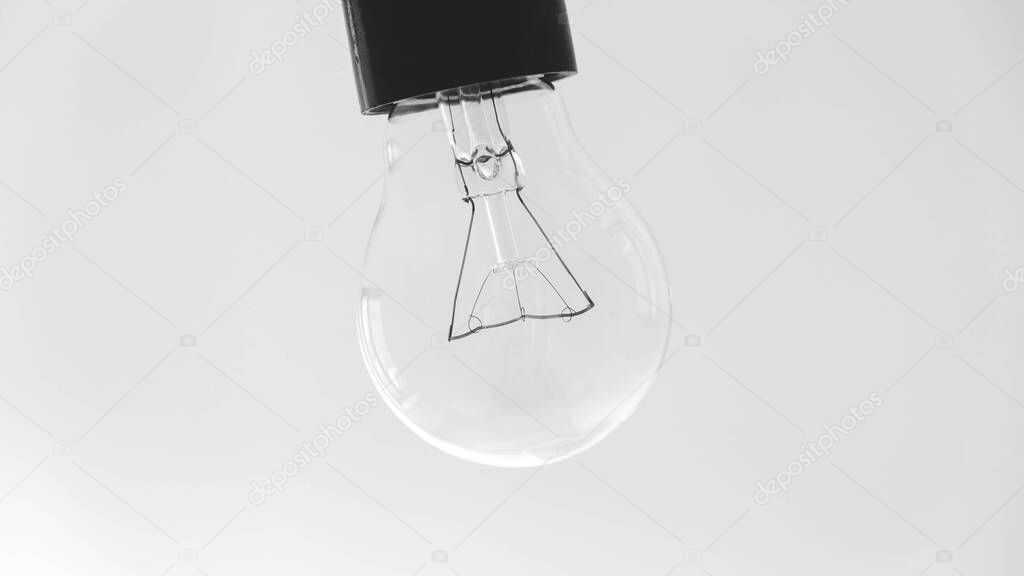 Transparent light bulb on a white background.
