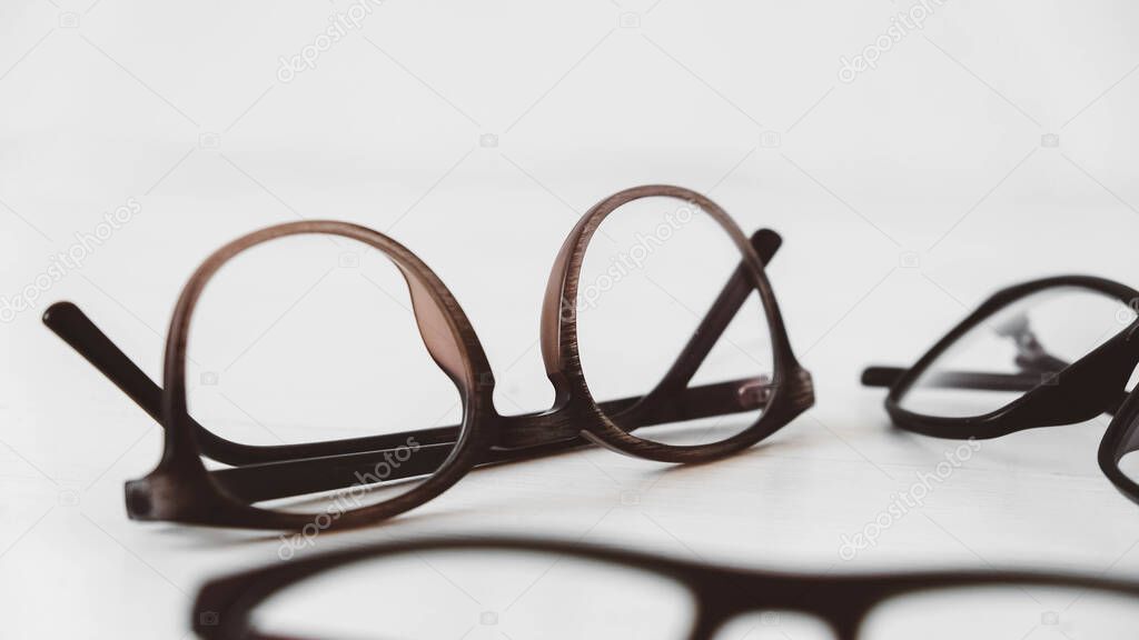 Optical glasses of different shapes on a white background.