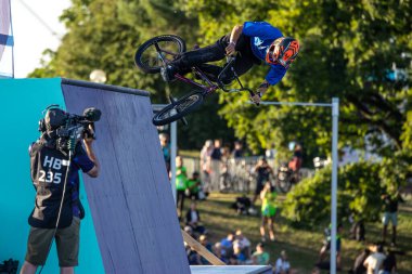 Munich, Germany - Aug 11, 2022: Riders compete at the BMX Freestyle European Championsships at Olympiapark in Munich, Germany. Men's qualifiacation