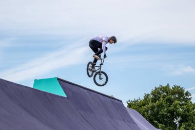 Munich, Germany - Aug 11, 2022: Riders compete at the BMX Freestyle European Championsships at Olympiapark in Munich, Germany. Men's qualifiacation