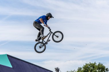 Munich, Germany - Aug 11, 2022: Riders compete at the BMX Freestyle European Championsships at Olympiapark in Munich, Germany. Men's qualifiacation