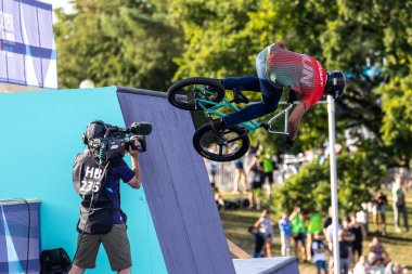 Munich, Germany - Aug 11, 2022: Riders compete at the BMX Freestyle European Championsships at Olympiapark in Munich, Germany. Men's qualifiacation