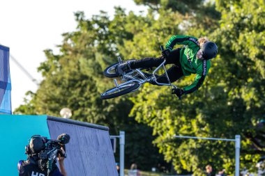 Munich, Germany - Aug 11, 2022: Riders compete at the BMX Freestyle European Championsships at Olympiapark in Munich, Germany. Men's qualifiacation