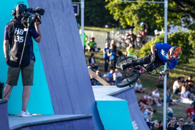 Munich, Germany - Aug 11, 2022: Riders compete at the BMX Freestyle European Championsships at Olympiapark in Munich, Germany. Men's qualifiacation