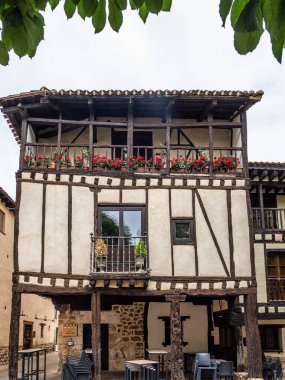 The old town of the medieval village of Covarrubias, Burgos, Castilla y Leon, Spain. Traditional streets with traditional patterns on the buildings walls in the medieval town
