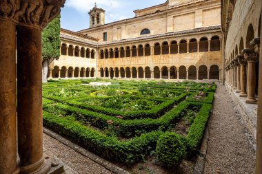 The cloister of Santo Domingo de Silos Abbey at Burgos, Spain. It is a Benedictine monastery and a masterpiece of Romanesque art.