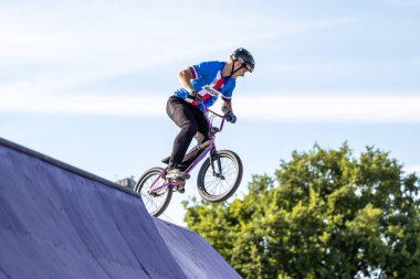 Munich, Germany - Aug 11, 2022: Riders compete at the BMX Freestyle European Championsships at Olympiapark in Munich, Germany. Men's qualifiacation