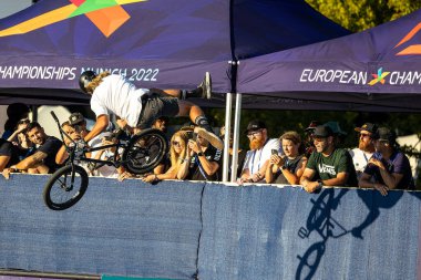 Munich, Germany - Aug 11, 2022: Riders compete at the BMX Freestyle European Championsships at Olympiapark in Munich, Germany. Men's qualifiacation