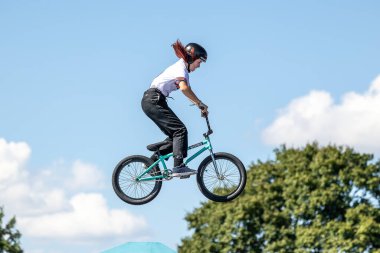 Munich, Germany - Aug 12, 2022: Riders compete at the BMX Freestyle European Championsships at Olympiapark in Munich, Germany. Men's qualifiacation