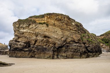 Natural rock arches Cathedrals beach, Playa de las catedrales at Ribadeo, Galicia, Spain. Famous beach in Northern Spain Atlantic. Natural rock arch on Cathedrals beach in low tide.