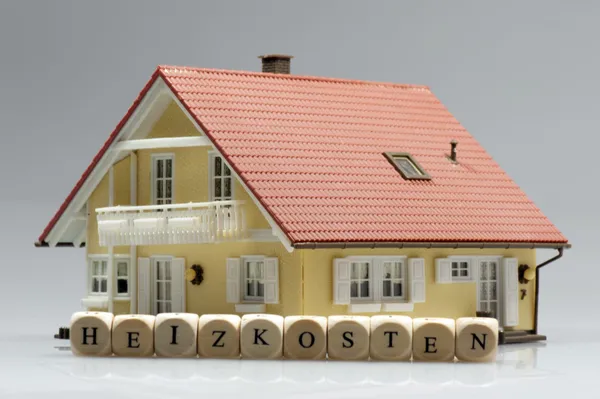 Model house with word heating costs — Stock Photo, Image