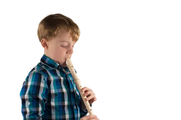 Chico joven toca la flauta —  Fotos de Stock
