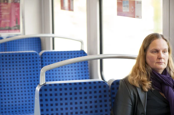 Photo of traveling passenger in train by the window — Stock Photo, Image