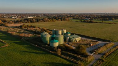Decommissioning of a biogas plant taken from the air perspective with a drone clipart