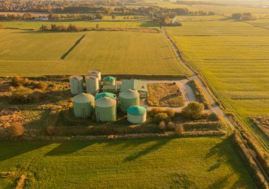 Decommissioning of a biogas plant taken from the air perspective with a drone clipart
