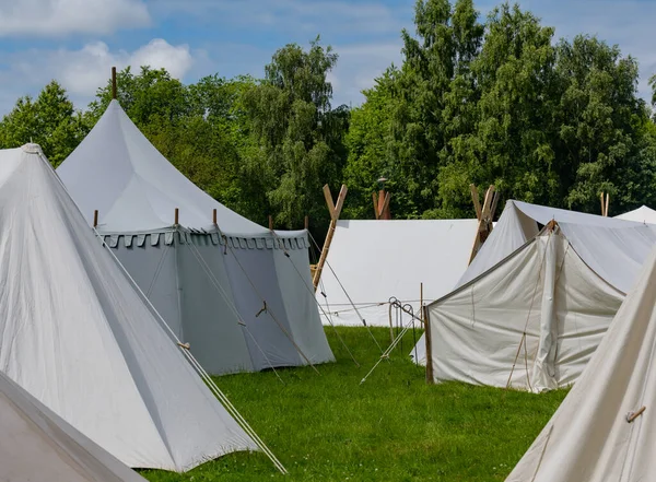 Tent camp and market stall at a medieval spectacle