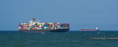 Container ship from the shipping company NYK FUJI with various containers entering the port of Durban on the Indian Ocean South Africa