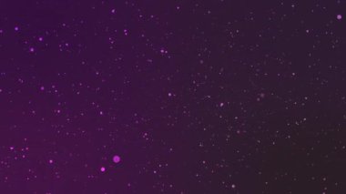 Pembe parıltılı parçacıkların arka planda parlayan ışık parlamaları ile 4k video.