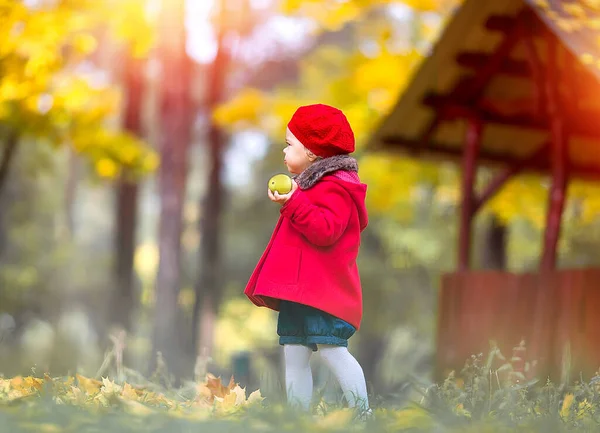 Cute Caucasian Little Girl Red Coat Beret Yellow Apple Walks — Stock Photo, Image