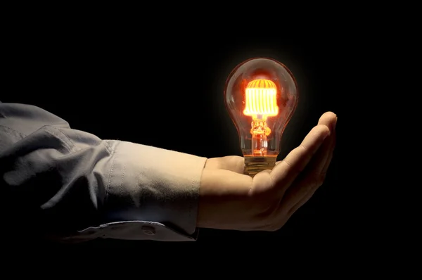 Hand holding light bulb — Stock Photo, Image