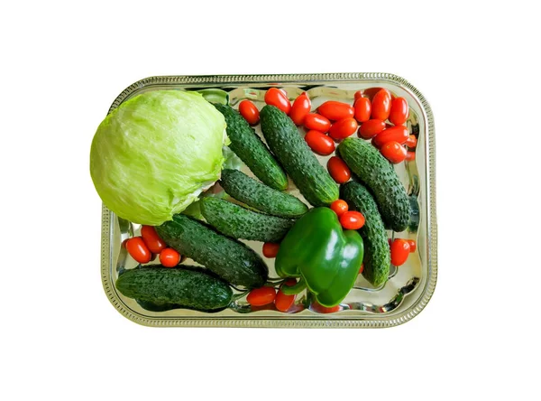 fresh organic vegetables in plastic container with water, cucumbers, cherry tomatoes, cabbage and green pepper