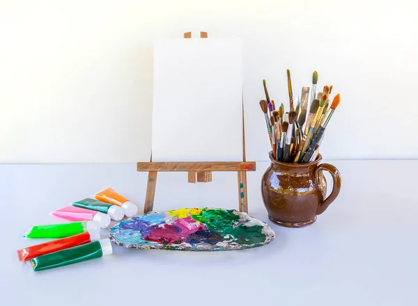 Artist Workplace Canvas Paints Brushes Palette Soft Light Background — Stock Fotó