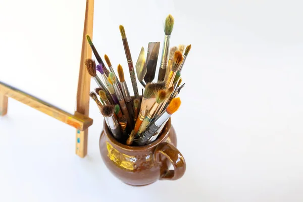Artist Workplace Canvas Wooden Easel Brushes Ceramic Jug — 图库照片