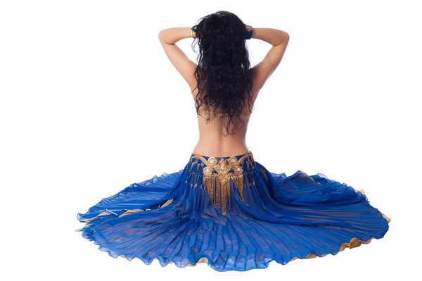 The back of a belly dancer in a blue costume. — Stock Photo, Image