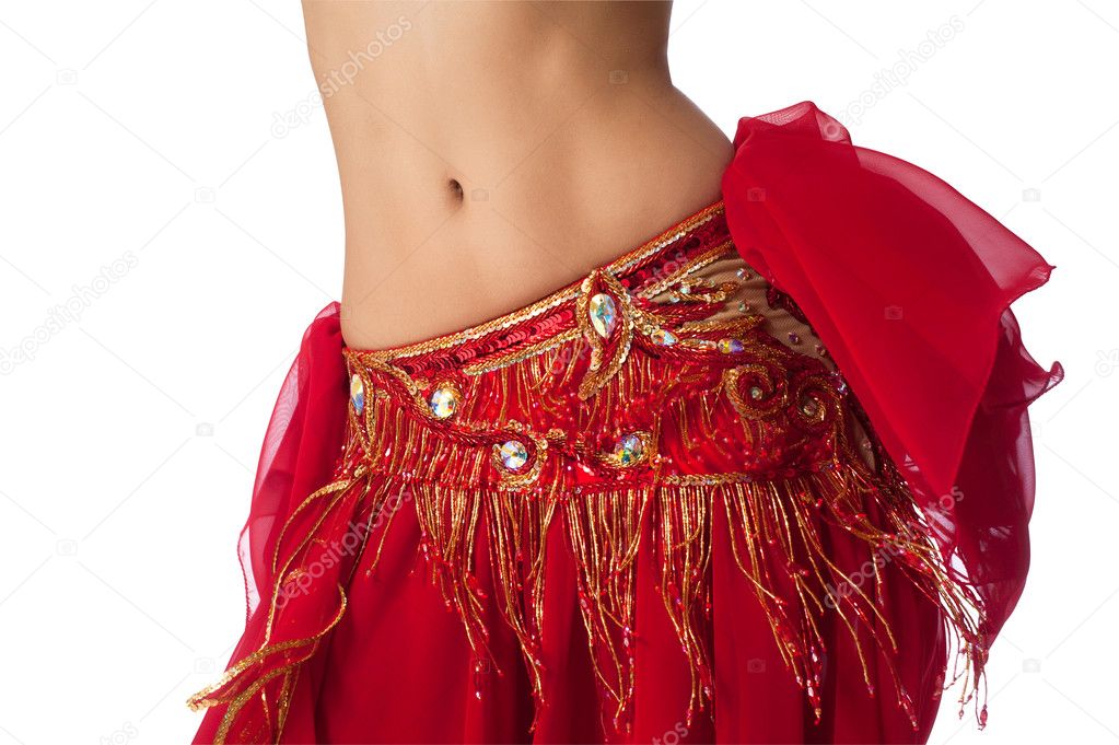 Close up shot of a belly dancer wearing a red costume shaking her hips.