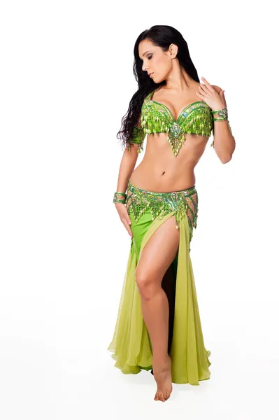 Beautiful belly dancer wearing a green costume. — Stock Photo, Image