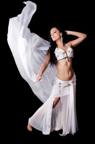 Brunette bellydancer dances with a flowing, white silk veil. — Stock Photo, Image