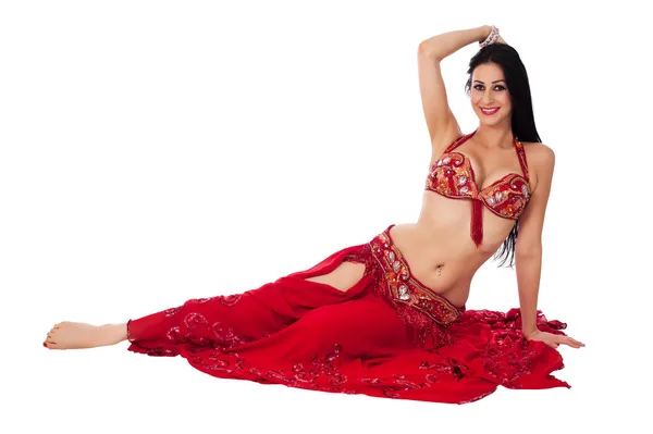 Beautiful belly dancer in a red costume — Stock Photo, Image