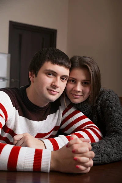 Loving couple sitting at the table — Stock Photo, Image