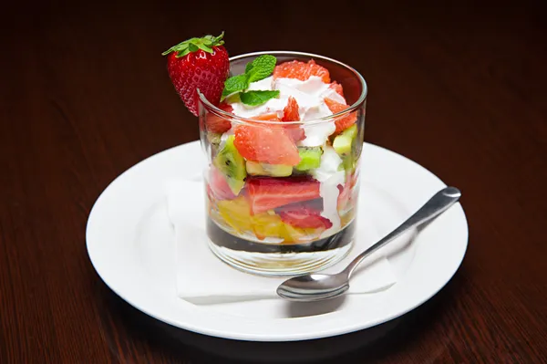 The menu - photo - appetizing dessert from fruits with cream