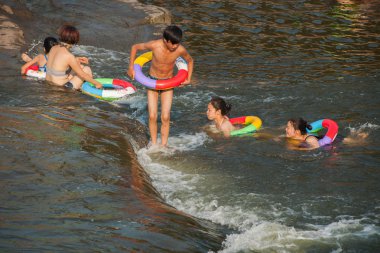 Chongqing citizens take advantage of the weekend in the summer to enjoy a cool summer in the Seto River Road Hole River Rongchang pleasant town next clipart