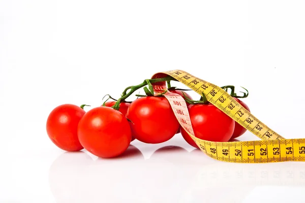Diet weight loss concept with tape measure organic tomatoes with — Stock Photo, Image