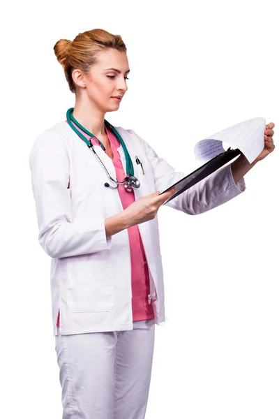 Medic analyzing clipboard with attention — Stock Photo, Image