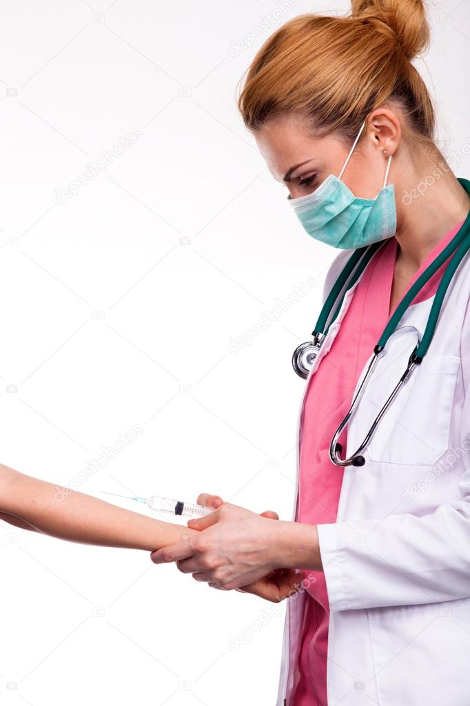 young doctor give injection to caucasian arm