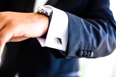 hand with watch and cufflinks clipart