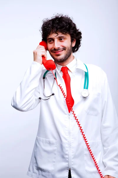 Doctor speaking at telephone — Stock Photo, Image