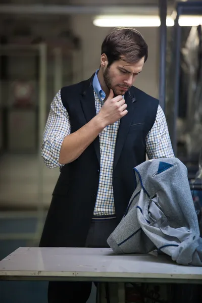 Young tailor man in action — Stock Photo, Image
