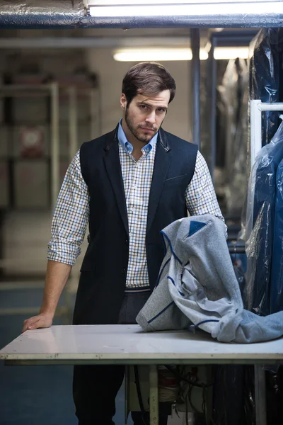 Portrait of a serious young tailor man at the store — Stock Photo, Image