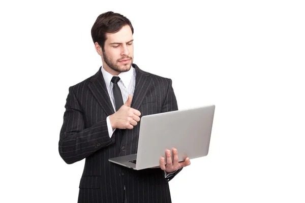 Businessman showing ok with a laptop — Stock Photo, Image