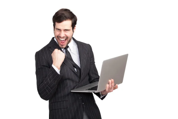 Excited businessman with a laptop — Stock Photo, Image