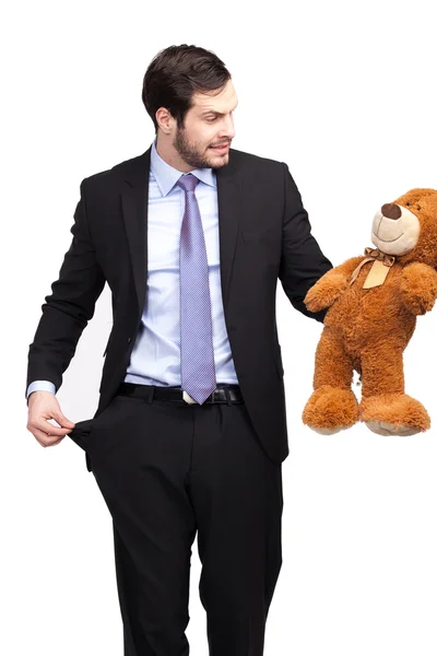 Broke businessman with teddy bear — Stock Photo, Image