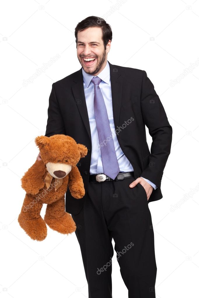 Handsome businessman with teddy bear