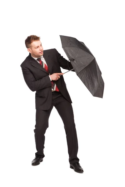 Eleganter Mann verteidigt mit Regenschirm — Stockfoto