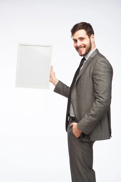 Elegante man met ingelijste board — Stockfoto