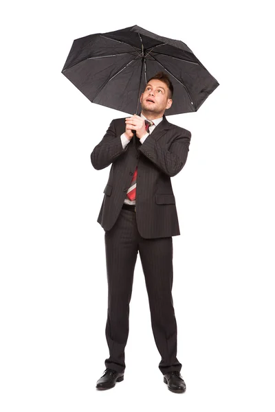 Surprised businessman with umbrella Royalty Free Stock Images